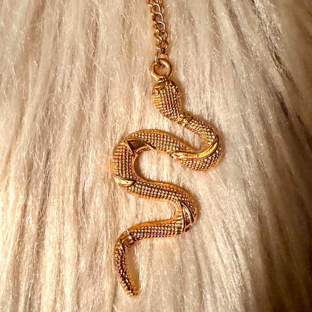 Gold in colour, snake necklace